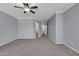 Bedroom with neutral walls and carpet flooring. Arched doorway and ceiling fan at 2738 W Silver Fox Way, Phoenix, AZ 85045