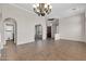 Formal dining room with elegant chandelier, recessed lighting, and easy access to the kitchen at 2738 W Silver Fox Way, Phoenix, AZ 85045