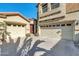 Home exterior showcasing a three-car garage and a welcoming front door at 2738 W Silver Fox Way, Phoenix, AZ 85045