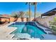 Inviting pool with a multi-tier design and a stone waterfall feature at 2738 W Silver Fox Way, Phoenix, AZ 85045