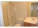 Well-lit bathroom featuring a tub-shower combination, white toilet, and single sink vanity with traditional fixtures at 3145 W Sandra Ter, Phoenix, AZ 85053