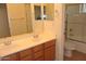 Bathroom with a double vanity, mirrors, and a walk-in shower at 3145 W Sandra Ter, Phoenix, AZ 85053