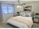 Bedroom with a bed, ceiling fan, and natural lighting at 3145 W Sandra Ter, Phoenix, AZ 85053