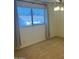 Bedroom showcasing neutral carpet, window, and ceiling fan at 3145 W Sandra Ter, Phoenix, AZ 85053