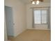 Bright bedroom featuring neutral walls and carpet, with large windows covered by light-filtering blinds and curtains at 3145 W Sandra Ter, Phoenix, AZ 85053