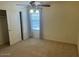 Carpeted bedroom featuring natural light, ceiling fan, and closet at 3145 W Sandra Ter, Phoenix, AZ 85053