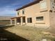 View of the rear of the home with covered patio and lawn at 3145 W Sandra Ter, Phoenix, AZ 85053