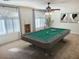 Entertainment game room with a pool table, natural light, and modern decor at 3145 W Sandra Ter, Phoenix, AZ 85053