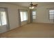 Spacious living room with abundant natural light from multiple windows and a cozy ceiling fan at 3145 W Sandra Ter, Phoenix, AZ 85053