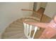 Carpeted staircase with wood railing leads to the upper level, offering an appealing transition between floors at 3145 W Sandra Ter, Phoenix, AZ 85053