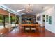 Bright and airy dining area with natural light, mid-century modern décor and backyard access for indoor-outdoor living at 3237 E Meadowbrook Ave, Phoenix, AZ 85018