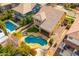 Aerial view of backyard featuring a freeform pool, stone landscaping, and lounging area at 3548 E Mesquite St, Gilbert, AZ 85296