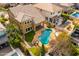 Aerial view of a backyard featuring a freeform pool, stone landscaping, and lounging area at 3548 E Mesquite St, Gilbert, AZ 85296