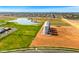 Scenic aerial shot showcasing the community lake and green spaces, highlighting nearby houses and the surrounding landscape at 3548 E Mesquite St, Gilbert, AZ 85296