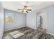 Bedroom featuring hardwood floors, ceiling fan, and ensuite bathroom at 3548 E Mesquite St, Gilbert, AZ 85296