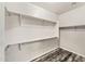 Walk-in closet with adjustable shelving and hardwood floors at 3548 E Mesquite St, Gilbert, AZ 85296