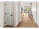 Hallway features wood-look floors and arched doorways to the living room and stairs to the second level at 3548 E Mesquite St, Gilbert, AZ 85296