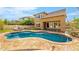 Swimming pool view showing the home and lush green grass at 3548 E Mesquite St, Gilbert, AZ 85296