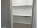 Open walk-in closet ready to be organized with plenty of shelving space for storage at 3646 E Roland St, Mesa, AZ 85215