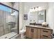 Modern bathroom with a glass-enclosed shower, sleek vanity, and contemporary lighting at 377 E Windsor Ave # 2, Phoenix, AZ 85004