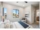 Bright bedroom featuring large windows, a cozy chair, and contemporary decor at 377 E Windsor Ave # 2, Phoenix, AZ 85004