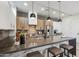 Spacious kitchen with an island, stainless steel appliances, and modern pendant lighting at 377 E Windsor Ave # 2, Phoenix, AZ 85004