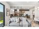 Comfortable living room featuring a modern kitchen, gray sofa, and stylish accents at 377 E Windsor Ave # 2, Phoenix, AZ 85004