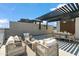 Stylish rooftop deck with dining and lounge areas, perfect for outdoor entertaining at 377 E Windsor Ave # 2, Phoenix, AZ 85004