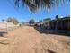 Expansive backyard with a mix of dirt and dry grass, ready for customization at 3932 W Bethany Home Rd, Phoenix, AZ 85019