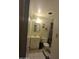 Small bathroom with combined shower/tub, sink and mirror, and a toilet at 3932 W Bethany Home Rd, Phoenix, AZ 85019