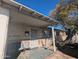 Inviting front porch area with chairs and brick facade under blue skies at 3932 W Bethany Home Rd, Phoenix, AZ 85019