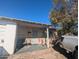 Charming front porch with chairs on a sunny day, accented by a mature tree at 3932 W Bethany Home Rd, Phoenix, AZ 85019