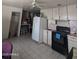 Spacious kitchen with essential appliances and access to additional storage at 3932 W Bethany Home Rd, Phoenix, AZ 85019