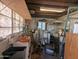 Functional utility room featuring storage shelves and ample space for tools and equipment at 3932 W Bethany Home Rd, Phoenix, AZ 85019