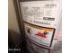 Up close view of a hot water heater with gas and safety warnings at 3932 W Bethany Home Rd, Phoenix, AZ 85019