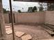 View of the backyard with desert landscaping, a gravel floor, and wood gate at 4107 E Charter Oak N Rd, Phoenix, AZ 85032