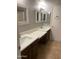 Bathroom with double sinks and quartz countertop vanity at 4107 E Charter Oak N Rd, Phoenix, AZ 85032