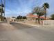 Community entrance with lush landscaping and signage at 4107 E Charter Oak N Rd, Phoenix, AZ 85032