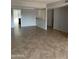 Large living room with tile flooring and light gray walls at 4107 E Charter Oak N Rd, Phoenix, AZ 85032