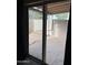 View of the outdoor patio through a sliding glass door at 4107 E Charter Oak N Rd, Phoenix, AZ 85032