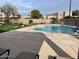 Community pool with lounge chairs and shade at 4107 E Charter Oak N Rd, Phoenix, AZ 85032