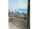 Scenic view of rooftops and palm trees from a window at 4107 E Charter Oak N Rd, Phoenix, AZ 85032