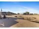 Spacious desert backyard featuring a small bridge and easy access to RV and other outdoor amenities at 43611 N 1St Dr, New River, AZ 85087