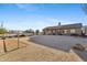 Desert backyard with a covered patio area, offering a relaxing space to enjoy the natural surroundings at 43611 N 1St Dr, New River, AZ 85087