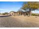 Exterior view of a home with desert landscaping and a spacious gravel yard at 43611 N 1St Dr, New River, AZ 85087