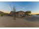 View of home's detached garage with desert landscaping at 43611 N 1St Dr, New River, AZ 85087