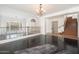 Upper level view of a living room featuring hardwood floors, staircase and chandelier at 4485 N 152Nd Dr, Goodyear, AZ 85395