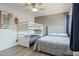 Neutral bedroom with a bed, bunk bed, fan, decor, and wood-look flooring at 4630 N 68Th St # 213, Scottsdale, AZ 85251