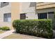 Exterior view of a unit with well-maintained landscaping and a secure entry at 4630 N 68Th St # 213, Scottsdale, AZ 85251