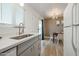 Galley kitchen with stainless steel sink overlooking the dining area at 4630 N 68Th St # 213, Scottsdale, AZ 85251